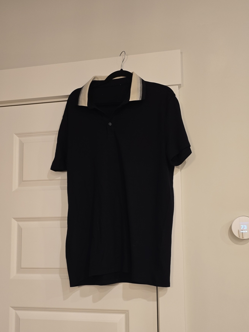 Black Polo Shirt with White Stripe Collar
